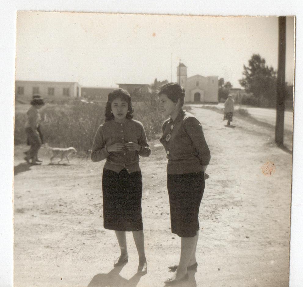 Gudalupe with a friend infront of Immaculate Conception Catholic church in 1963